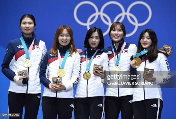 South Korea's gold medallists Shim Suk-hee, Choi Minjeong, Kim Yejin, Kim Alang and Lee Yubin pose on the podium during the medal ceremony for the...