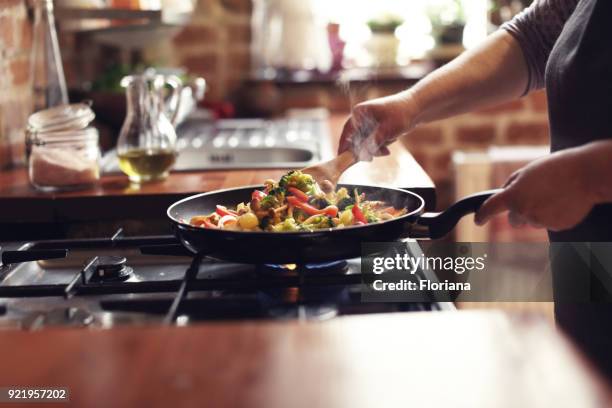 cooking vegetables, step six, mixing - home cooking pan stock pictures, royalty-free photos & images