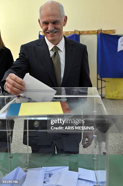 Greek main opposition leader, President of the Greek socialist party PASOK, George Papandreou casts his vote during Greece's general elections in...