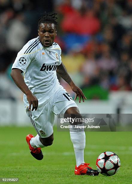 Royston Drenthe of Real Madrid runs with the ball during the Champions League group C match between Real Madrid and AC Milan at the Estadio Santiago...