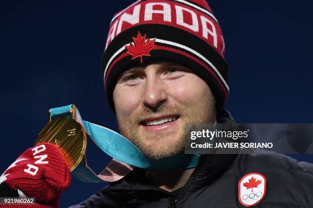 Canada's gold medallist Brady Leman poses on the podium during the medal ceremony for the freestyle skiing Men's Ski Cross at the Pyeongchang Medals...