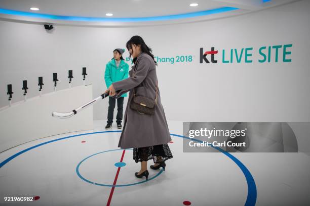 Woman plays virtual hockey as she visits the PyeongChang 2018 Winter Olympics Live Site on February 21, 2018 in Seoul, South Korea. With tourists...