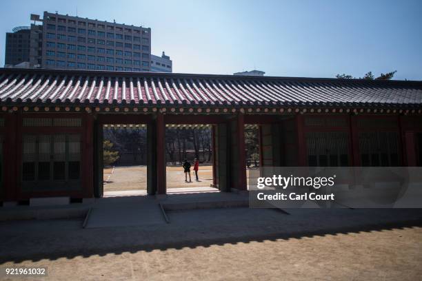 Men chat as they visit Deoksugung Palace on February 21, 2018 in Seoul, South Korea. With tourists visiting from around the world, leaders from South...