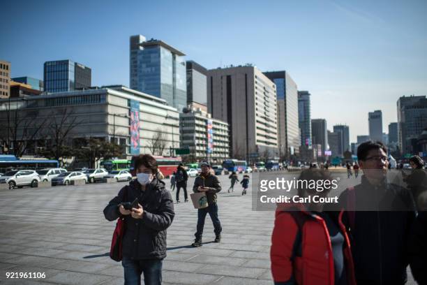 Tourists pass through Gwanghwamun Square on February 21, 2018 in Seoul, South Korea. With tourists visiting from around the world, leaders from South...