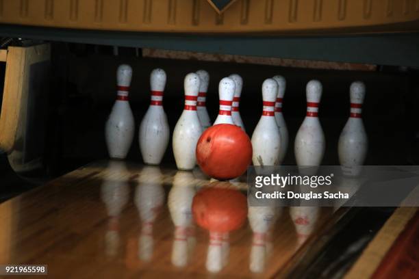 ball and pins at a bowling alley - bowling pins stock-fotos und bilder
