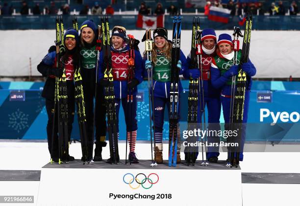 Silver medalists Stina Nilsson and Charlotte Kalla of Sweden, gold medalists Kikkan Randall and Jessica Diggins of the United States and bronze...
