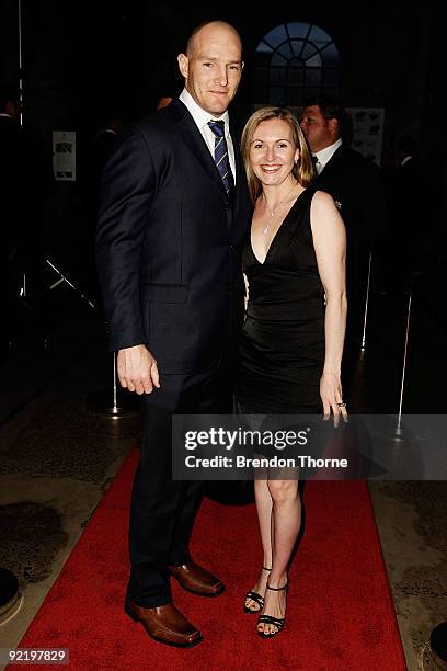 Stirling Mortlock and wife Caroline Mortlock pose for a photograph during the John Eales Medal Dinner at the Carriage Works on October 22, 2009 in...