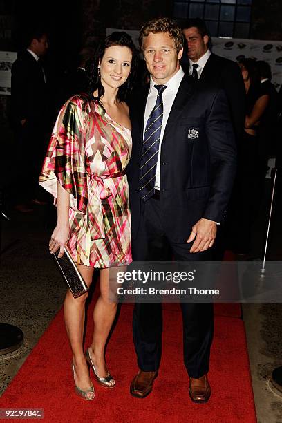 Peter Hynes and partner Bree Nothling pose for a photograph during the John Eales Medal Dinner at the Carriage Works on October 22, 2009 in Sydney,...