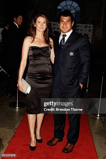 George Smith and wife Louise Smith pose for a photograph during the John Eales Medal Dinner at the Carriage Works on October 22, 2009 in Sydney,...