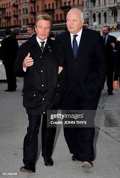 French Foreign minister Bernard Kouchner speaks with Spanish Foreign minister Miguel Angel Moratinos as they arrive at the Vasa Museum in Stockholm...