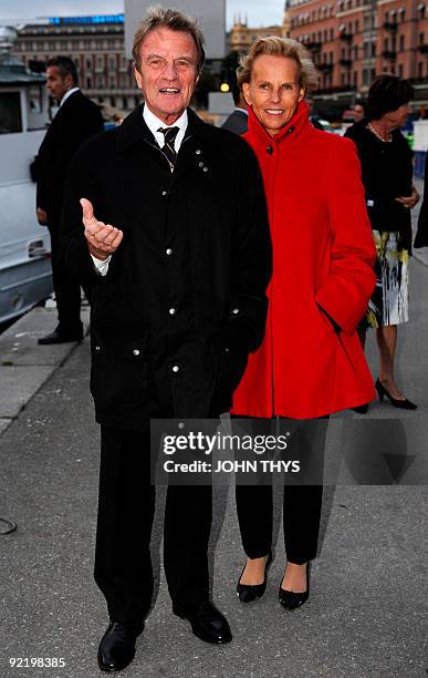 French Foreign minister Bernard Kouchner poses with his wife Christine Ockrent as they arrive at the Vasa Museum in Stockholm before an official...