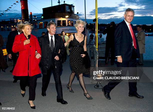 Swedish Foreign Minister Carl Bildt with his wife Maria Corazza Bildt arrive with French Foreign Minister Bernard Kouchner with his wife Christine...