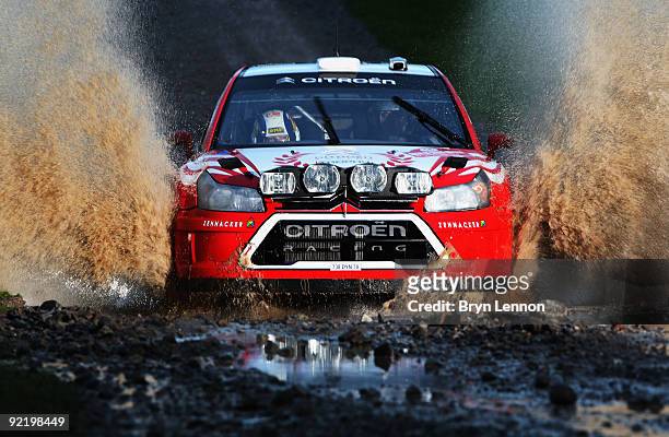 Aaron Burkart of Germany and the Citroen Junior Team drives through the water splash during Shakedown for the Wales Rally GB on October 22, 2009 in...