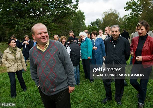 Sweden's minister for agriculture Eskil Erlandsson guides EU agriculture ministers during a visit to a farm near Vaxjo, Sweden, on September 14...