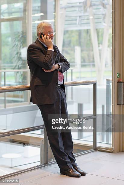 Governor of the state of Hesse and of the Christian Democratic Union Roland Koch, uses his phone prior to the next round of coalition negotiations...