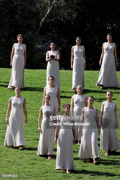 Women dresssed as priestesses perform during the Ceremony of the Lighting of the Olympic Flame for the Vancouver 2010 Winter Olympic Games at the...