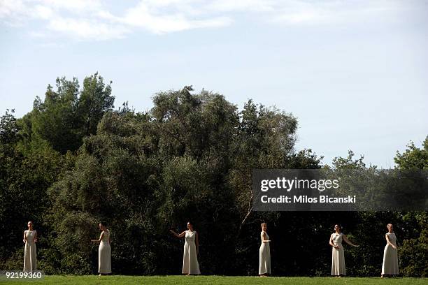 Dancers dressed as priestesses perform during the Ceremony of the Lighting of the Olympic Flame for the Vancouver 2010 Winter Olympic Games at the...