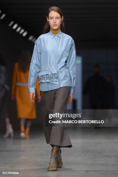 Model presents a creation by Albino Teodoro during the women's Fall/Winter 2018/2019 collection fashion show in Milan, on February 21, 2018. / AFP...