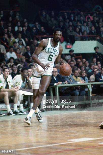 Bill Russell of the Boston Celtics moves the ball up court during a game played in 1967 at the Boston Garden in Boston, Massachusetts. NOTE TO USER:...