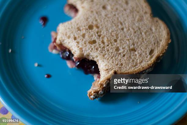 peanut butter sandwich with bites out of it - peanut butter and jelly sandwich fotografías e imágenes de stock