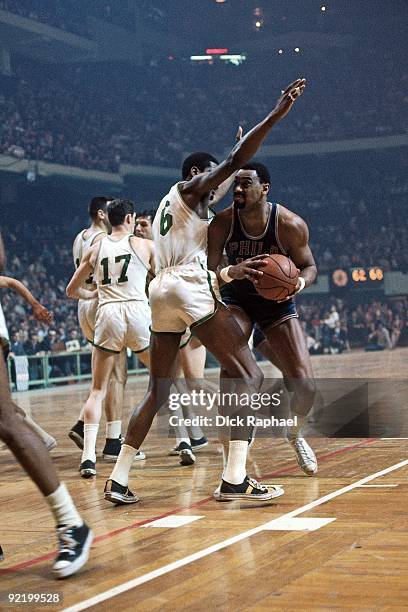Wilt Chamberlain of the Philadelphia 76ers posts up against Bill Russell of the Boston Celtics during a game played in 1967 at the Boston Garden in...