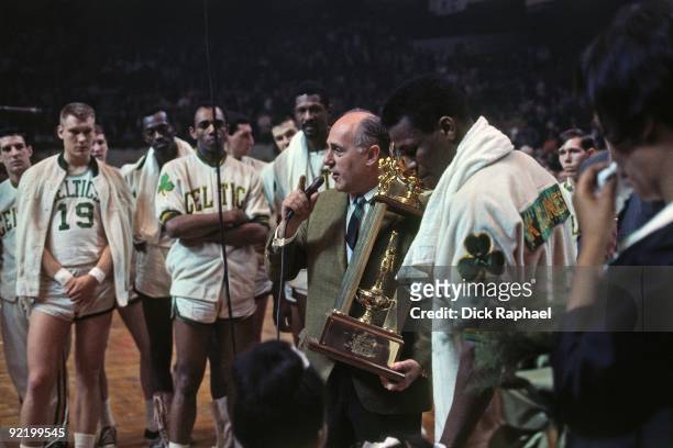 Red Auerbach, head coach of the Boston Celtics addresses the audience during a game played in 1967 at the Boston Garden in Boston, Massachusetts....