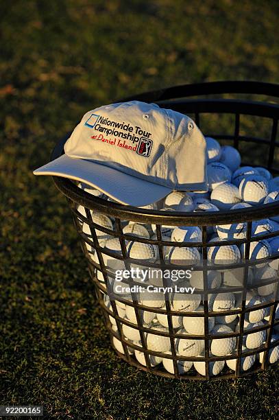 Hat sits atop a basket of balls on the practice green during the first round for the Nationwide Tour Championship at Daniel Island on October 22,...