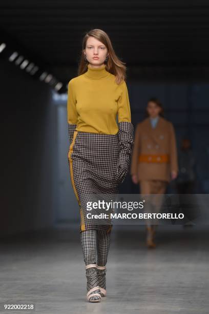 Model presents a creation by Albino Teodoro during the women's Fall/Winter 2018/2019 collection fashion show in Milan, on February 21, 2018. / AFP...