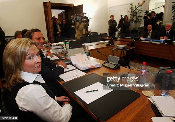 Olympic speed skating champion Claudia Pechstein and her lawyer Christian Kraehe look on at the court of Arbitration for Sport on October 22, 2009 in...