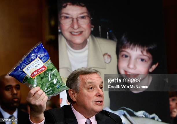 Sen. Richard Durbin holds up a package of bagged spinach as he testifies before the Senate Health, Education, Labor and Pensions Committee on...