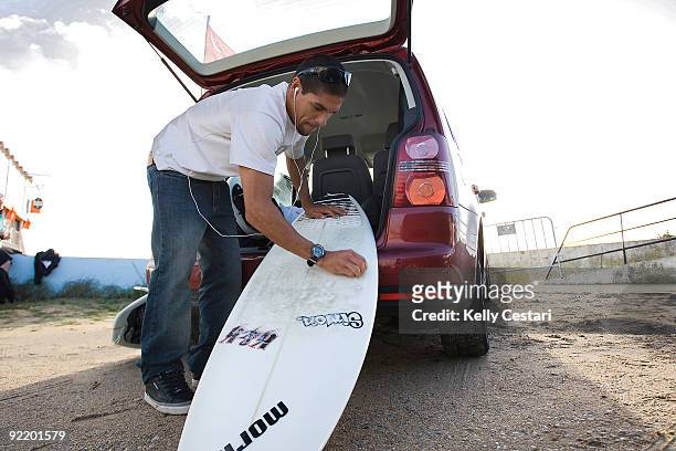 Heitor Alves of Brasil prepares the wax on his surfboard before his Round 1 heat of the Rip Curl Pro Search on October 22, 2009 in Peniche, Portugal.