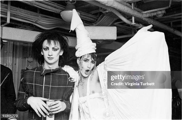Boy George and a friend with fellow New Romantics watch Spandau Ballet perform live on HMS Belfast on July 26 1980