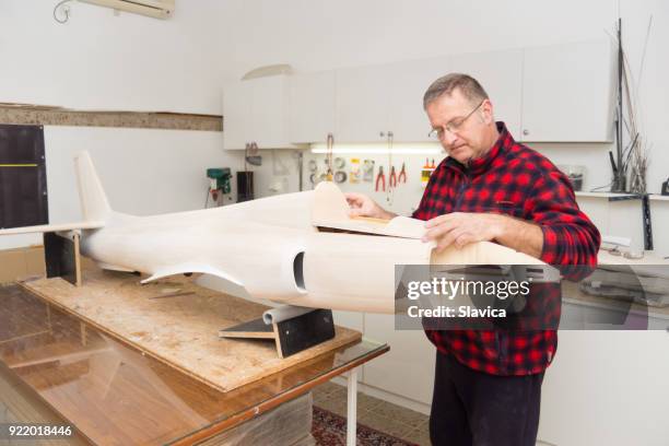 carpenter making airplane model - making model airplane stock pictures, royalty-free photos & images