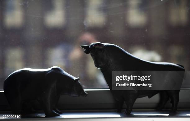 Bear and a bull statues sit on a windowsill following a news conference to announce the Deutsche Boerse AG earnings at the Frankfurt Stock Exchange...