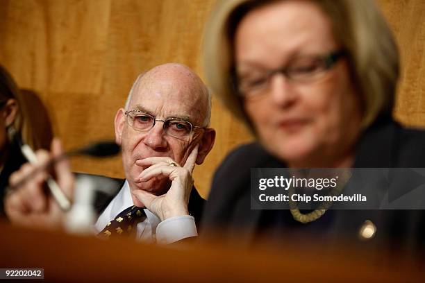 Senate Homeland Security and Governmental Affairs Committee members Sen. Robert Bennett listens as Sen. Claire McCaskill points out his previous...