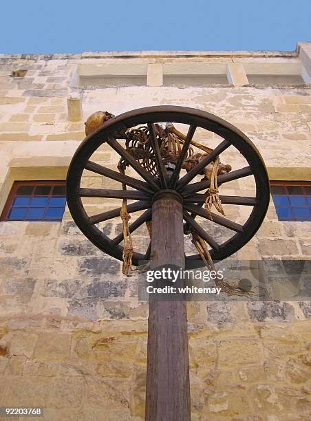 torture on the wheel - medieval torture stock pictures, royalty-free photos & images