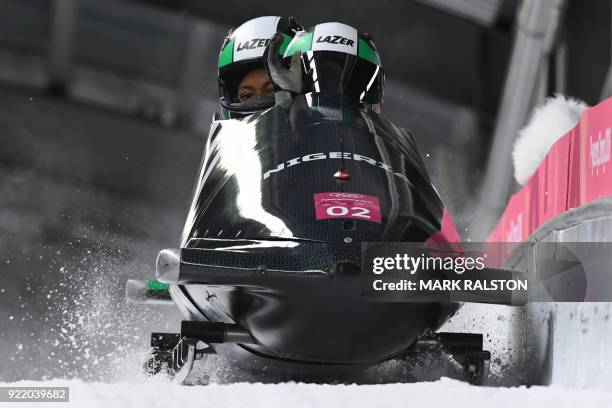 Nigeria's Moriam Seun Adigun and Ngozi Onwumere compete in the women's bobsleigh heat 3 run during the Pyeongchang 2018 Winter Olympic Games at the...