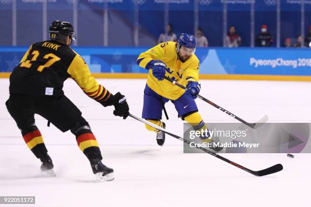 Mikael Wikstrand of Sweden skates against Marcus Kink of Germany during the Men's Play-offs Quarterfinals game on day twelve of the PyeongChang 2018...