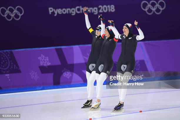Mia Manganello, Brittany Bowe and Heather Bergsma of the United States celebrate after winning the bronze medal during the Speed Skating Ladies' Team...