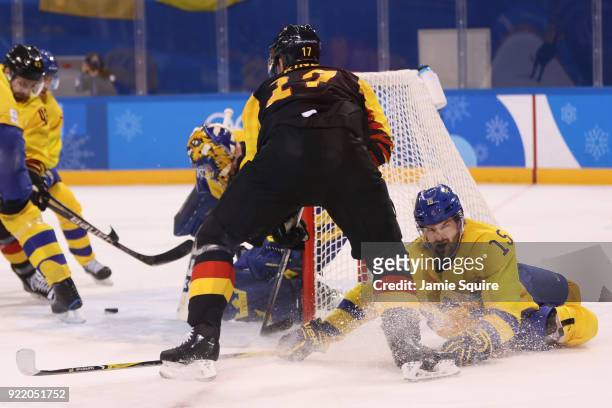 Marcus Kink of Germany attempts a shot on goal against Sweden during the Men's Play-offs Quarterfinals game on day twelve of the PyeongChang 2018...