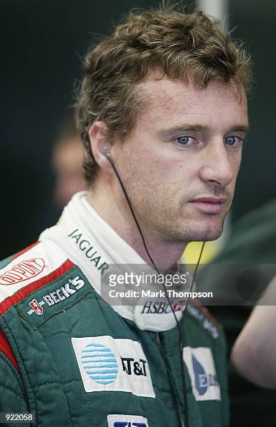 Eddie Irvine of Nothern Ireland and Jaguar prepares for qualifying for the British Grand Prix at Silverstone on July 6, 2002 at Silverstone Circuit,...