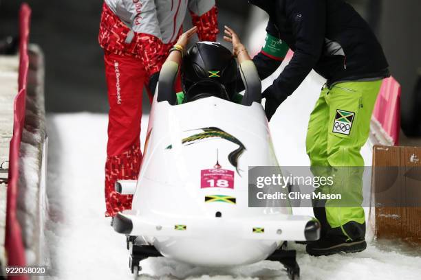 Jazmine Fenlator-Victorian and Carrie Russell of Jamaica react in the finish area during the Women's Bobsleigh heats on day twelve of the PyeongChang...