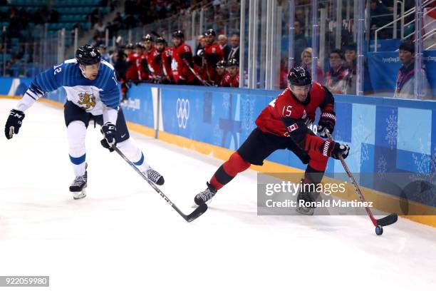 Brandon Kozun of Canada controls the puck against Marko Anttila of Finland in the second period during the Men's Play-offs Quarterfinals on day...