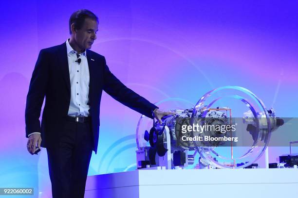 Volkmar Denner, chief executive officer of Robert Bosch GmbH, stands beside a a Bosch electric automobile axle while delivering a keynote speech at...