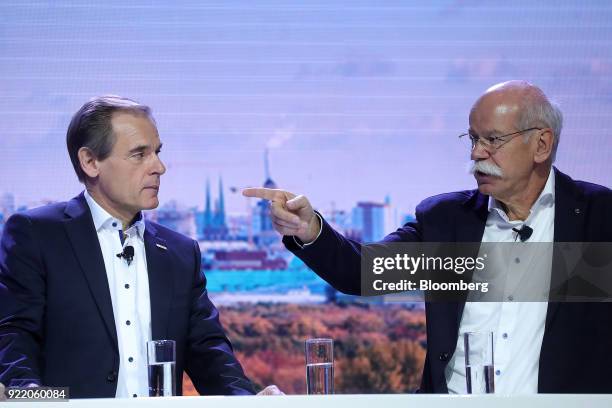 Dieter Zetsche, chief executive officer of Daimler AG, right, gestures while speaking beside Volkmar Denner, chief executive officer of Robert Bosch...