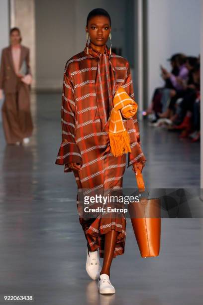 Model walks the runway at the Mother of Pearl show during London Fashion Week February 2018 at Newport Street Gallery on February 19, 2018 in London,...