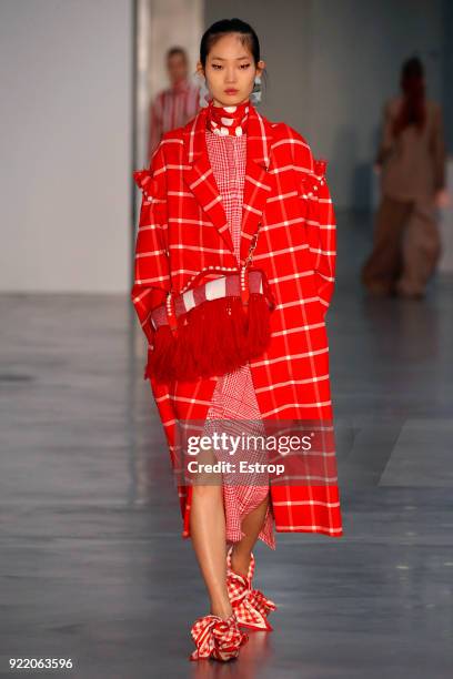 Model walks the runway at the Mother of Pearl show during London Fashion Week February 2018 at Newport Street Gallery on February 19, 2018 in London,...