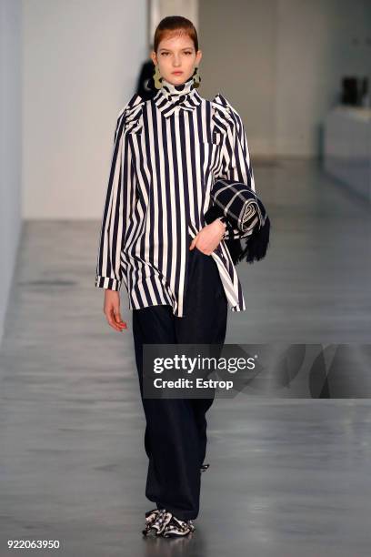 Model walks the runway at the Mother of Pearl show during London Fashion Week February 2018 at Newport Street Gallery on February 19, 2018 in London,...