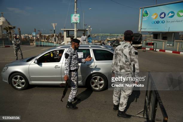 Palestinian members of Hamas security forces stop a vehicle at a security checkpoint in Gaza City on February 21, 2018.
