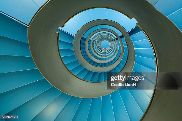 spiral staircase with endless blue facets - colour and abstract and impact not people stock pictures, royalty-free photos & images